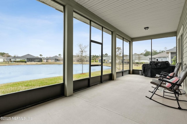 sunroom with a water view