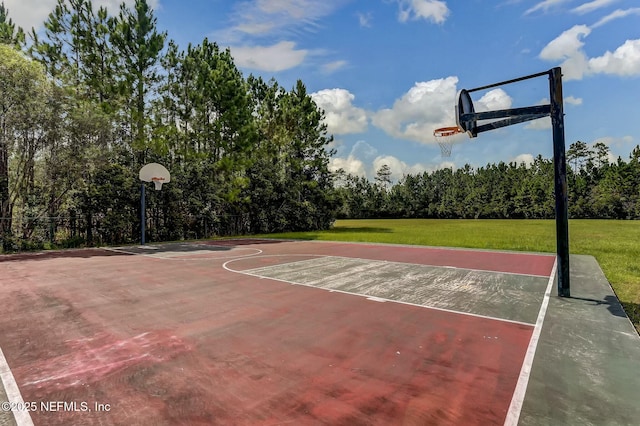 view of sport court with a yard and community basketball court