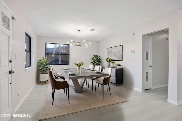 dining space with baseboards, light wood-type flooring, visible vents, and an inviting chandelier