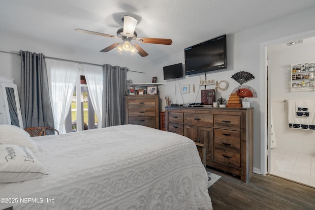 bedroom with a textured ceiling, dark wood-type flooring, and a ceiling fan