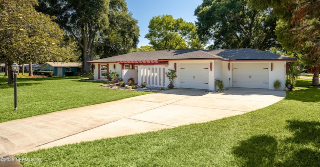 single story home featuring a garage, stucco siding, driveway, and a front yard