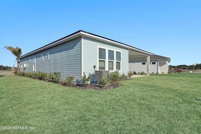 view of side of home featuring a yard