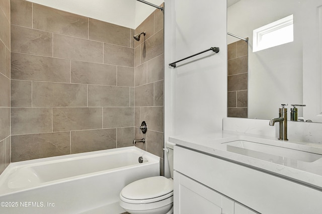 bathroom featuring shower / bathing tub combination, vanity, and toilet