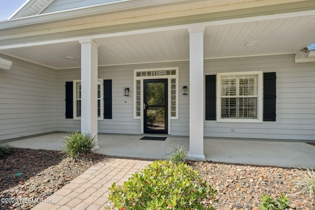 doorway to property with covered porch