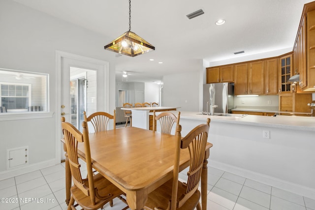 dining room featuring baseboards, light tile patterned flooring, visible vents, and recessed lighting