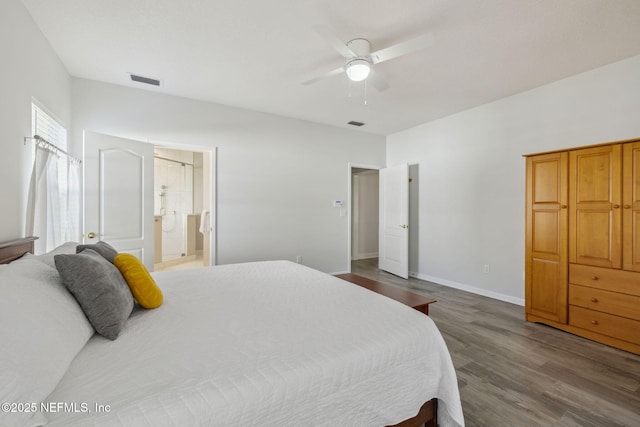 bedroom with visible vents, ceiling fan, connected bathroom, wood finished floors, and baseboards