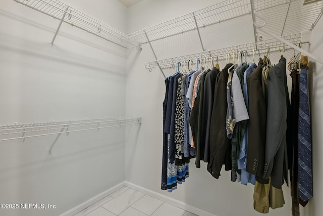 spacious closet featuring tile patterned flooring