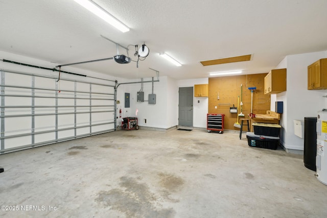 garage with a garage door opener and electric panel