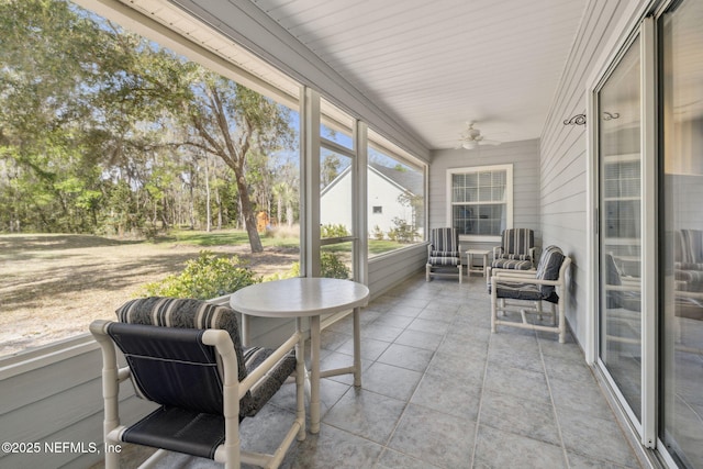 sunroom / solarium with ceiling fan