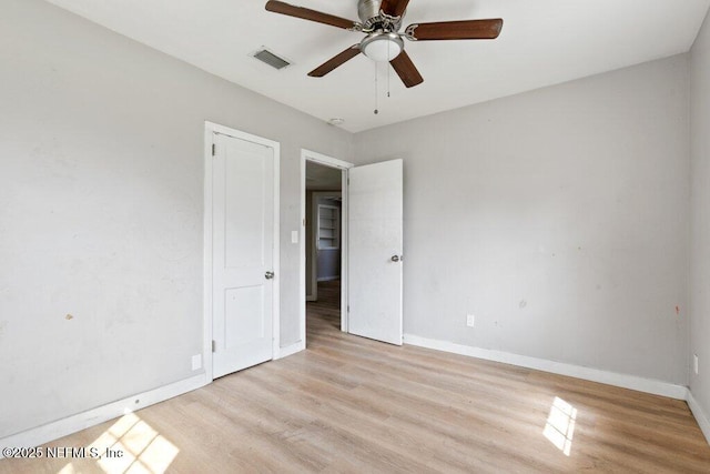 3135 Soutel Dr, Jacksonville, FL 32208 - unfurnished room with a ceiling fan, visible vents, baseboards, and wood finished floors