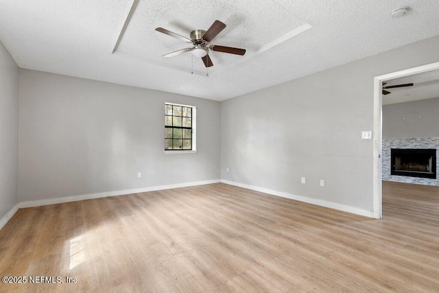 3135 Soutel Dr, Jacksonville, FL 32208 - spare room with a ceiling fan, light wood-type flooring, a raised ceiling, and baseboards