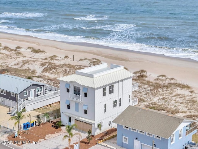 aerial view featuring a water view and a beach view