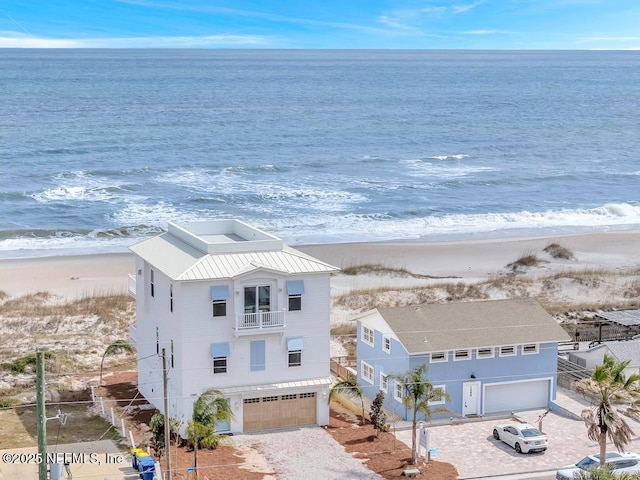 aerial view featuring a water view and a view of the beach