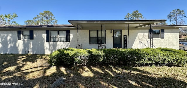 view of front of house with brick siding