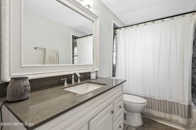 bathroom with vanity, toilet, and shower / bathtub combination with curtain