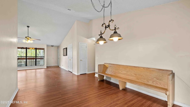 interior space with high vaulted ceiling, wood finished floors, visible vents, baseboards, and a ceiling fan