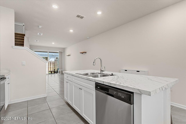 kitchen featuring a sink, visible vents, white cabinets, dishwasher, and a center island with sink