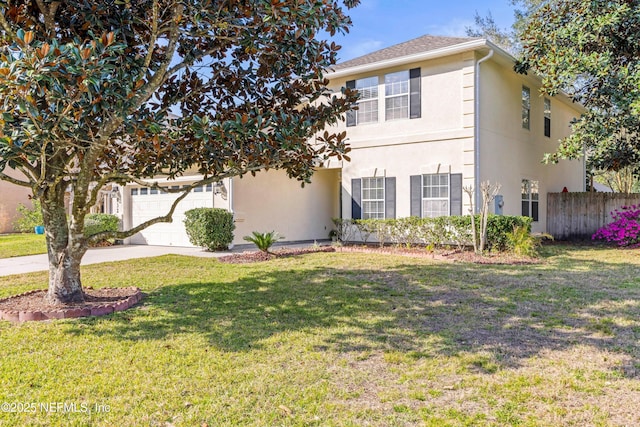 view of front of house featuring a garage, fence, driveway, stucco siding, and a front lawn