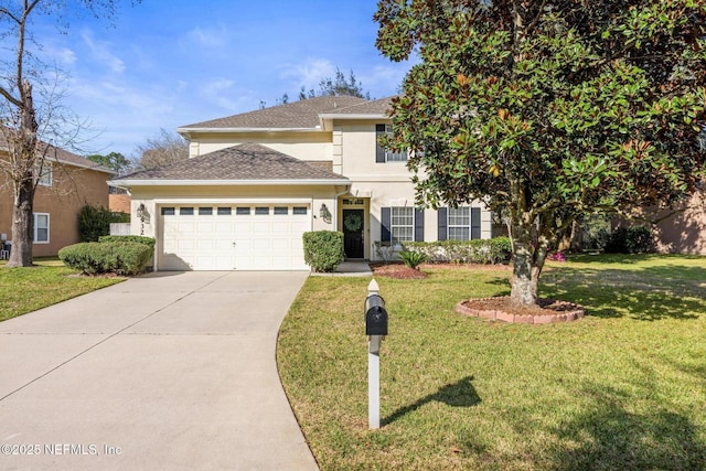 traditional home featuring stucco siding, a front yard, concrete driveway, and an attached garage