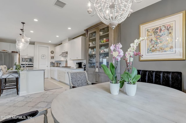 11334 Newtonian Blvd, Jacksonville, FL 32256 - dining space featuring an inviting chandelier, visible vents, and recessed lighting