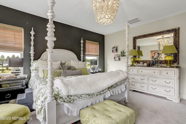 11334 Newtonian Blvd, Jacksonville, FL 32256 - carpeted bedroom with visible vents and a notable chandelier