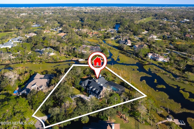 birds eye view of property featuring a water view