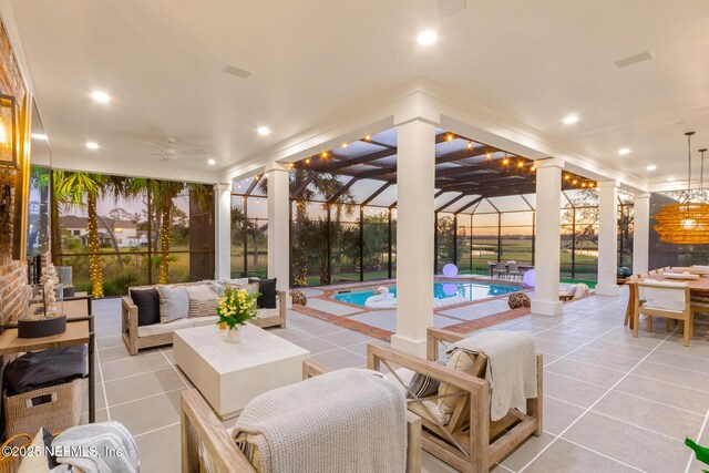 view of patio with a ceiling fan, glass enclosure, outdoor lounge area, and an outdoor pool