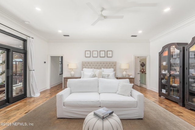 bedroom with access to outside, crown molding, and wood finished floors