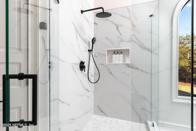 bathroom with a marble finish shower