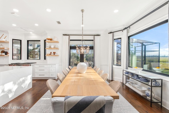 dining area with visible vents, dark wood finished floors, crown molding, and recessed lighting