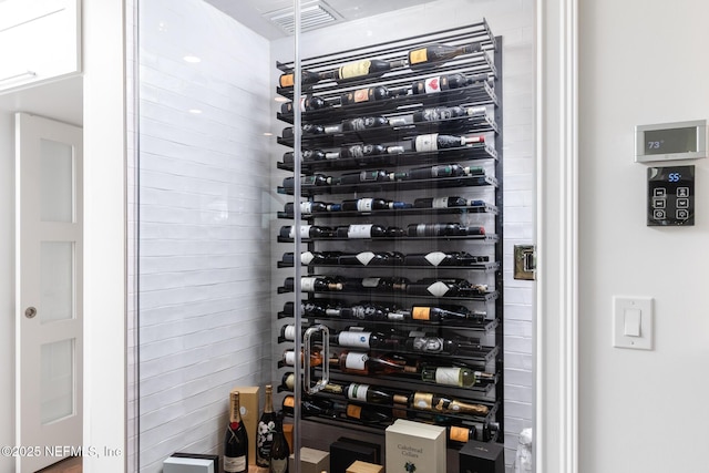 wine area featuring visible vents and electric panel