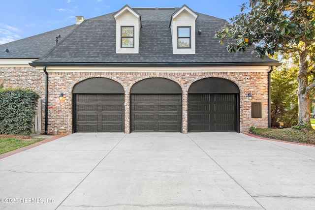 garage featuring driveway