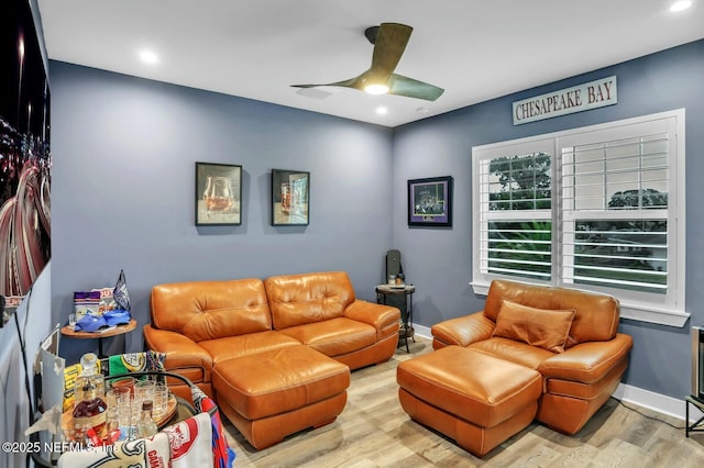 living room with a ceiling fan, recessed lighting, wood finished floors, and baseboards
