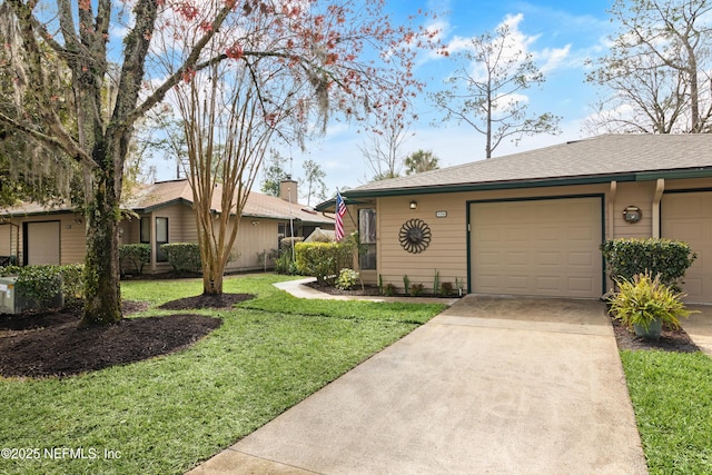 ranch-style home with driveway, a garage, and a front lawn