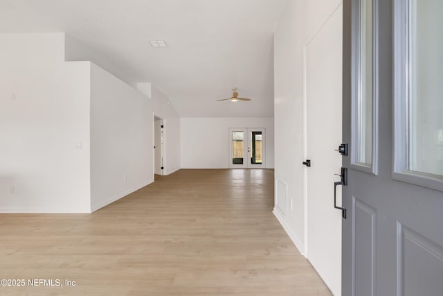 entrance foyer featuring ceiling fan, light wood-style flooring, and baseboards