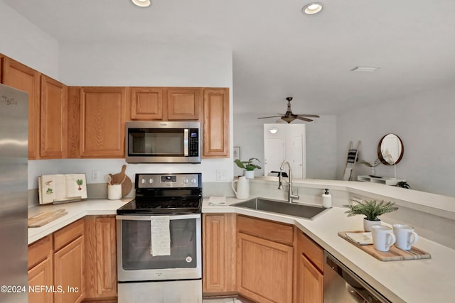 kitchen with recessed lighting, light countertops, appliances with stainless steel finishes, a sink, and ceiling fan