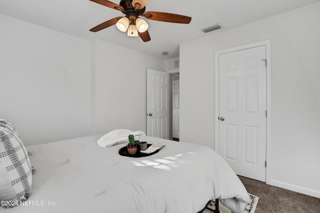 bedroom with carpet, visible vents, ceiling fan, and baseboards