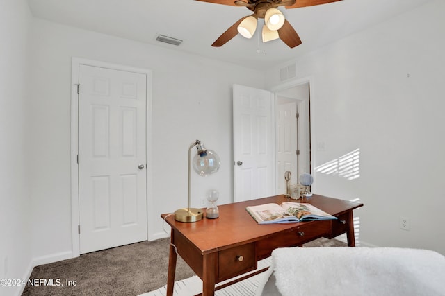 home office featuring carpet, visible vents, ceiling fan, and baseboards