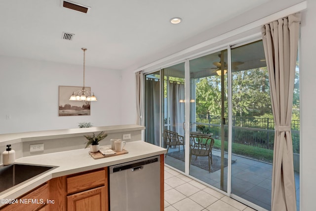 kitchen with visible vents, stainless steel dishwasher, pendant lighting, a sink, and light tile patterned flooring