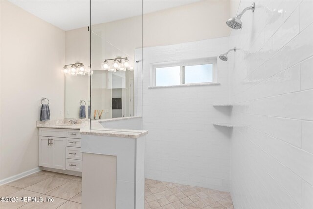 full bath featuring walk in shower and vanity