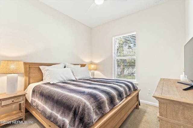 bedroom with carpet flooring and baseboards