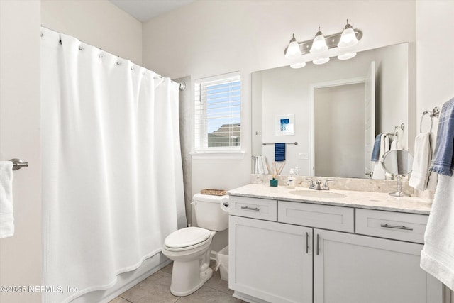 bathroom featuring vanity, tile patterned flooring, toilet, and a shower with curtain