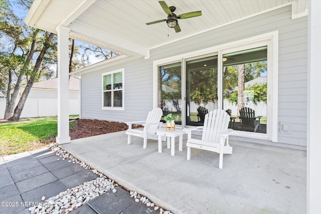 view of patio featuring ceiling fan