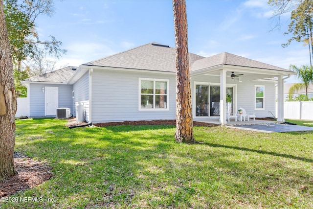 back of house featuring ceiling fan, fence, a yard, central air condition unit, and a patio area