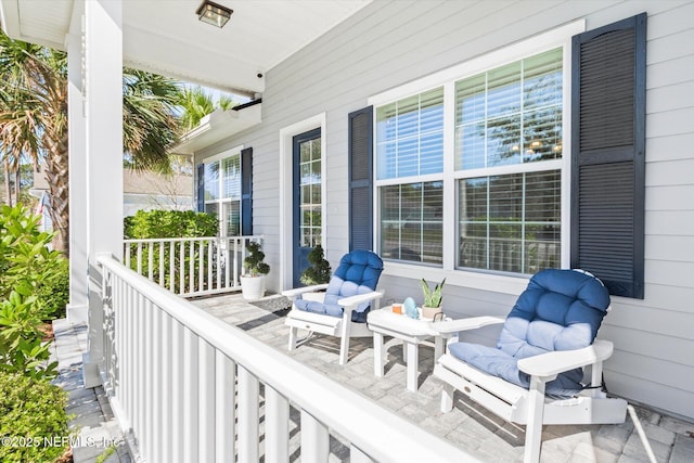 balcony featuring a porch