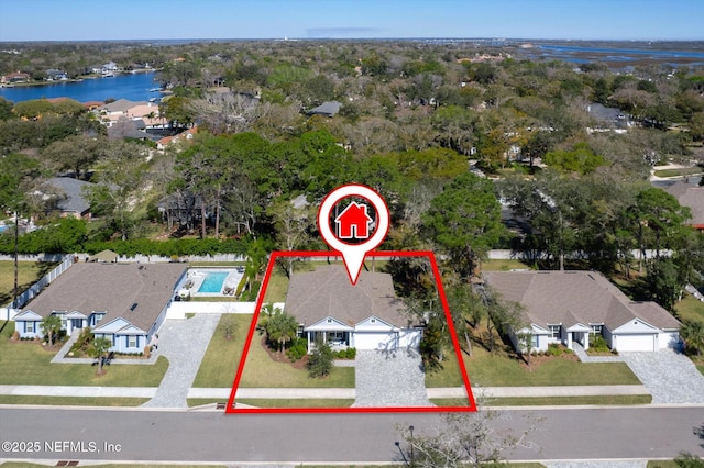 birds eye view of property with a residential view and a water view