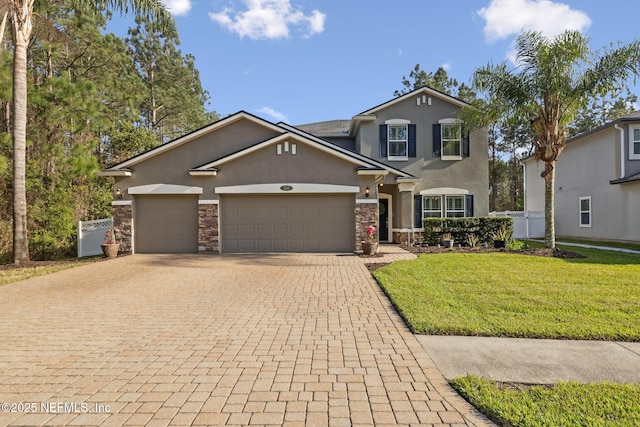 traditional-style home with decorative driveway, stucco siding, a garage, stone siding, and a front lawn