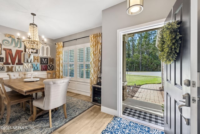 dining room featuring a notable chandelier and wood finished floors