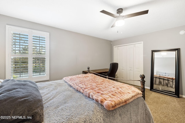 bedroom with ceiling fan, carpet floors, a closet, and baseboards