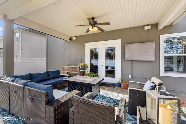 view of patio featuring french doors, an outdoor living space, and a ceiling fan